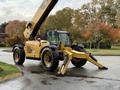 A yellow 2014 Caterpillar TL1055C telescopic handler with a large boom and front stabilizers parked on a surface