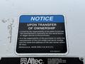 A notice label on a 2015 Freightliner M2 detailing responsibilities for transferring ownership and providing manufacturer's manual information