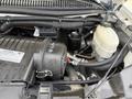 Close-up of the engine compartment of a 2017 Chevrolet Express showcasing the air intake system and various engine components