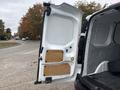 A 2019 Ford Transit Connect open cargo van door revealing interior panels and black flooring
