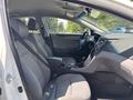 Interior view of a 2014 Hyundai Sonata showing the front seats dashboard and center console with a gear shift and controls