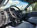 Interior view of a 2016 Ford F-750 showing the steering wheel dashboard and seats