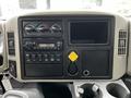 Interior dashboard of a 2011 International 4400 featuring gauges a radio and control buttons