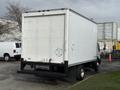A 2008 International CityStar truck with a large white cargo box and dual rear wheels parked with its back panel facing the viewer