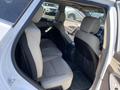 Interior view of a 2018 Hyundai Santa Fe showing the back seats with two bucket seats and a central armrest