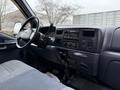 Interior of a 2001 Ford F-350 featuring the dashboard steering wheel and controls with a focus on its design and layout