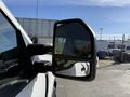 A close-up view of the side mirror of a 2021 Ford F-250 SD showing the mirror's reflective surface and design
