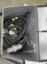 A 2005 Katolight SED60FPJ4 with several black cables coiled inside a metallic compartment
