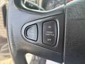 Close-up of the steering wheel controls from a 2012 International 7300 Workstar featuring buttons for air horn cruise throttle and off