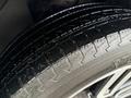 Close-up of a tire from a 2018 Toyota 4Runner showcasing the tread pattern and rubber texture