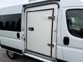A 2020 RAM Promaster van with a large white side door featuring a metallic handle and latch