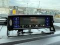 A control panel inside a 2019 Ford F-750 featuring various buttons and a digital display with an indication of settings and measurements