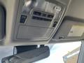 Interior view of a 2018 Toyota Highlander showing the overhead console with light controls and a rearview mirror