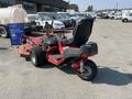 A 2017 Ferries Lawn Mower with a red body and black seat featuring large rear wheels and a cutting deck at the front ready for use