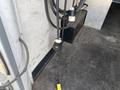 A 2008 Wells Industries Inc EW1422 with black cords and a yellow connector on the floor