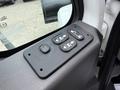 Control panel with four buttons for door operations on a 2012 International TerraStar