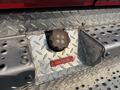 Diesel fuel cap on a Freightliner FL80 with a diamond plate surface and a warning label indicating diesel fuel only