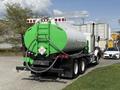A green and silver 1996 Kenworth T800 tanker truck with a large cylindrical tank and visible hoses on the rear