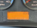 Dashboard display of a 2013 International CE300 showing hour meter reading 25121 and various gauges for RPM and speed