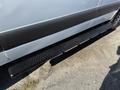 Side step rail of a 2023 Mercedes-Benz Sprinter 2500 showcasing a textured surface for enhanced grip and a sleek design