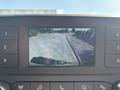 Dashboard display screen showing a rearview camera view from a 2025 Ford Transit T-350 with a clear depiction of a road and surrounding area
