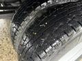 Close-up of the tires on a 2008 Ford F-350 showing deep treads designed for traction and durability