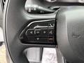 Steering wheel controls of a 2023 RAM Promaster 3500 featuring buttons for phone, voice command, and menu navigation
