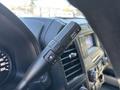 A close-up of the drive mode selector stalk on a 2019 Ford F-150 featuring buttons for adjusting drive modes