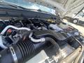Detailed view of the engine components of a 2016 Ford F-350 SD including various hoses tubes and electrical connections