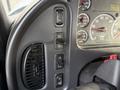 Dashboard controls and instrument cluster of a 2015 Freightliner M2 with various switches and gauges for monitoring vehicle functions