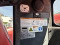 A control panel with various warning labels and indicators from a 2018 Sandvik Ranger DX800 drill rig