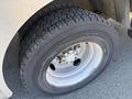 Close-up of a tire mounted on a 2009 Workhorse W62 showing tread pattern and metallic wheel rim