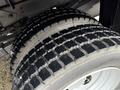 Close-up of a heavily treaded tire on a 2012 Dodge Ram 5500 showcasing its rugged design and deep grooves