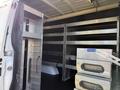 Interior of a 2023 Mercedes-Benz Sprinter 2500 showing metal shelving and drawers for storage