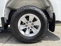 A close-up of a silver wheel and tire from a 2019 Chevrolet Silverado 1500 showing a distinct tread pattern and five-spoke alloy rim