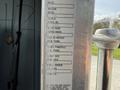 A metal plate with specifications for a 1996 Kenworth T800 including make model serial number engine model and transmission details