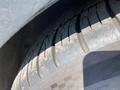 Close-up of a tire on a 2015 Bentley Continental GT showcasing tread pattern and sidewall details
