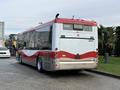2016 Grande West Vicinity bus with a red and white color scheme featuring a rear view showing its backlights and rear details