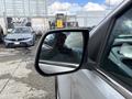 A 2018 Chevrolet Colorado with a side mirror reflecting the surroundings and a glimpse of the driver's seat interior