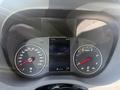 The dashboard of a 2025 Mercedes-Benz Sprinter featuring two circular dials for speed and RPM along with a digital display showing time and temperature