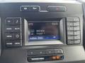 A black dashboard display of a 2017 Ford F-250 SD featuring radio controls and a digital screen showing the temperature and radio frequency