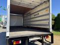 2022 Isuzu NQR box truck with an empty cargo area and wooden floor visible
