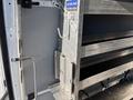 2024 Mercedes-Benz Sprinter 2500 interior with shelving unit mounted along the side and metal support structures visible