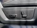 A close-up of the seat adjustment controls in a 2018 RAM 3500 featuring two buttons for adjusting the seat position