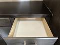 An empty wooden drawer of a 2021 Jayco Jay Flight with a smooth finish and a metallic handle