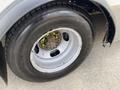 Close-up of the wheel and tire of a 2020 Chevrolet Express showing the rim tire tread and lug nuts