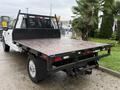 A 2019 Ford F-350 SD with an open flatbed designed for hauling cargo showing a sturdy platform and rear hitch attachment