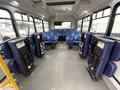 Interior of a 2020 Chevrolet Express with blue seating and no passengers visible