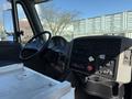 Interior view of a 2008 International 7500 truck showing the dashboard steering wheel gear shift and control panel