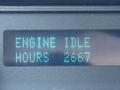 Display showing "ENGINE IDLE HOURS 2667" on a digital panel